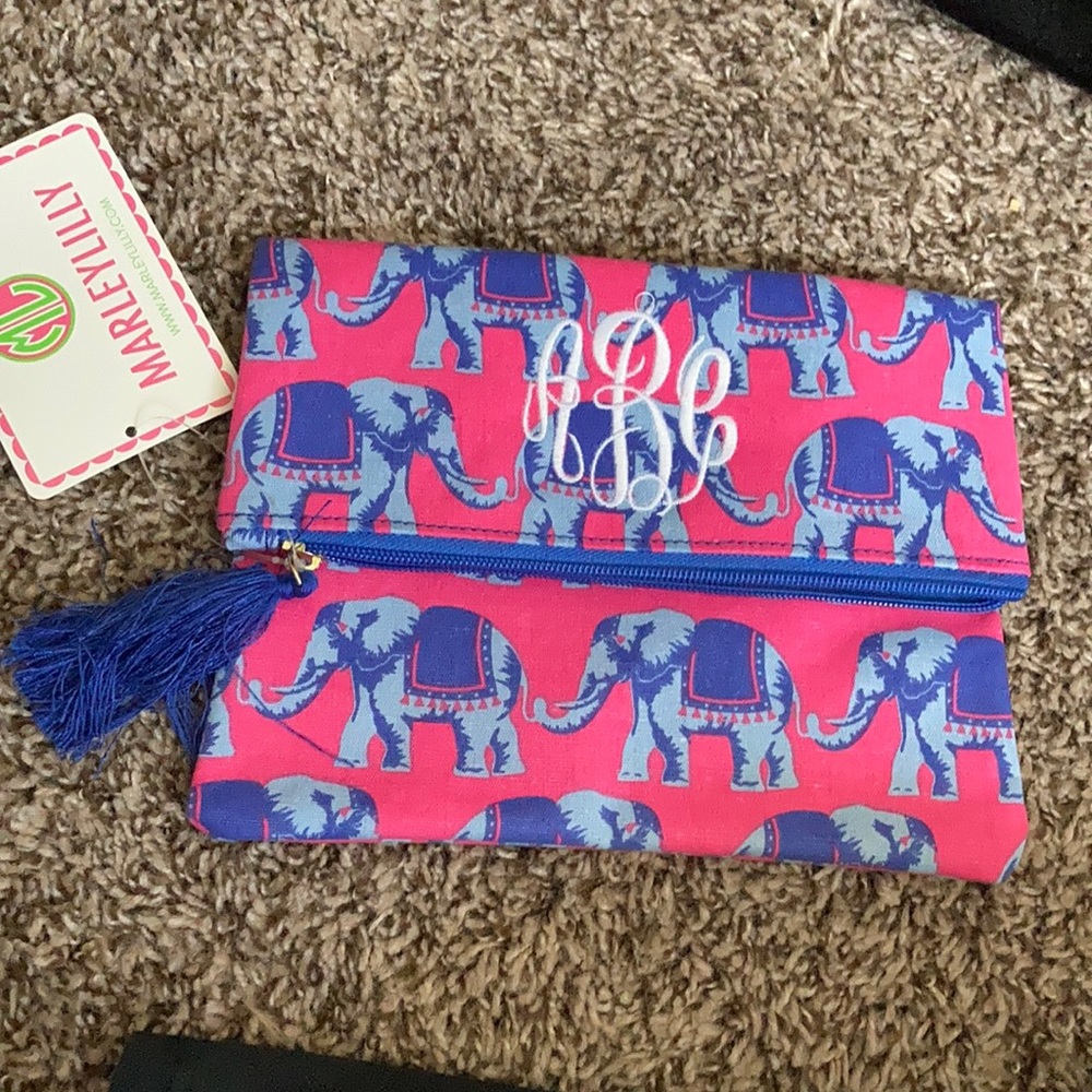 Fold over clutch with elephants